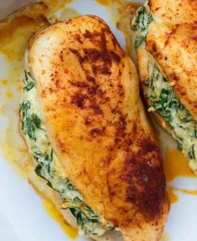 Spinach-stuffed chicken in a baking dish